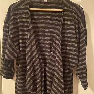 This grey-striped Sarah Cardigan by LulaRoe is a great laying piece.